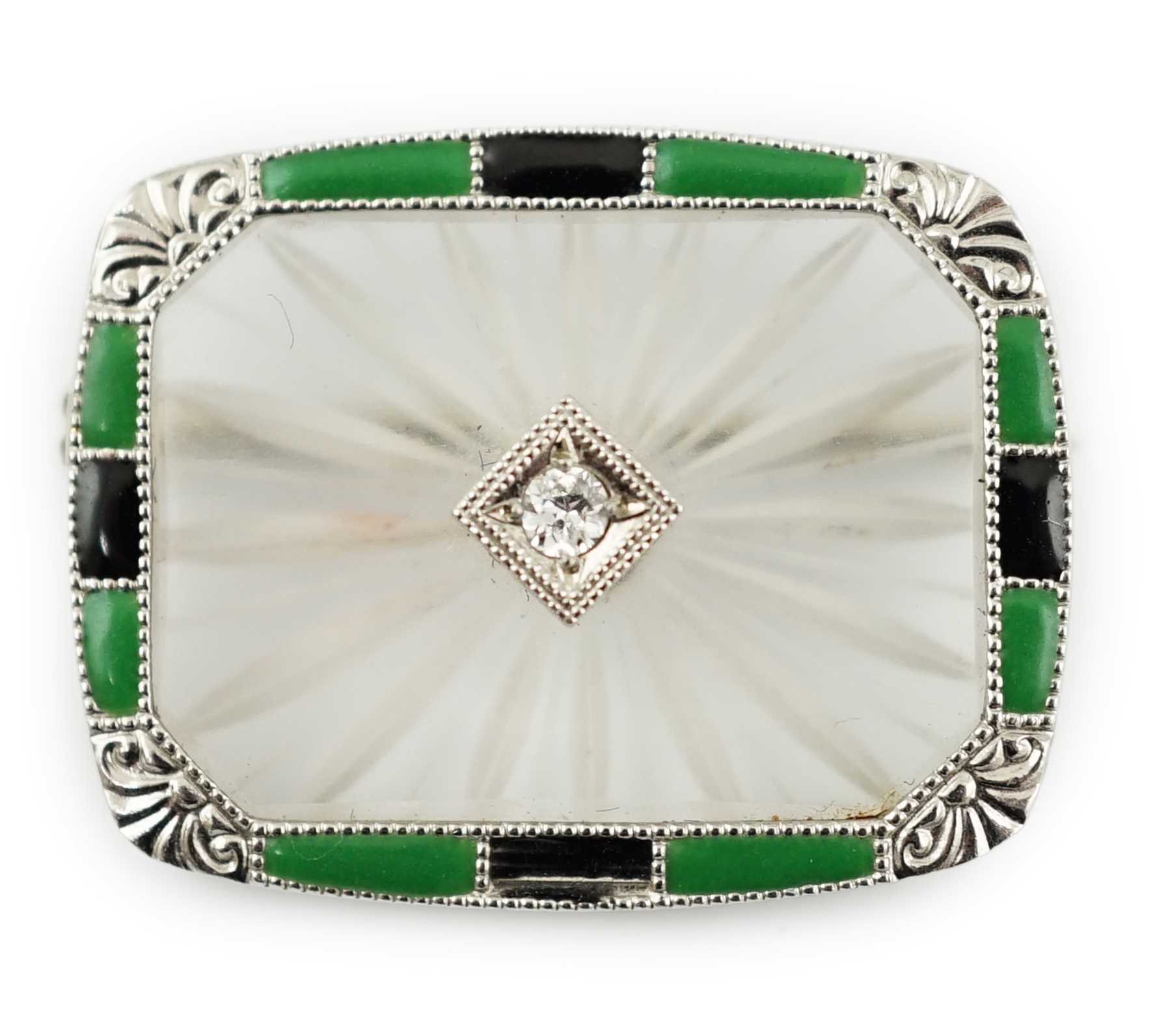 An Art Deco white gold, rock crystal, black onyx, chrysoprase and diamond set brooch